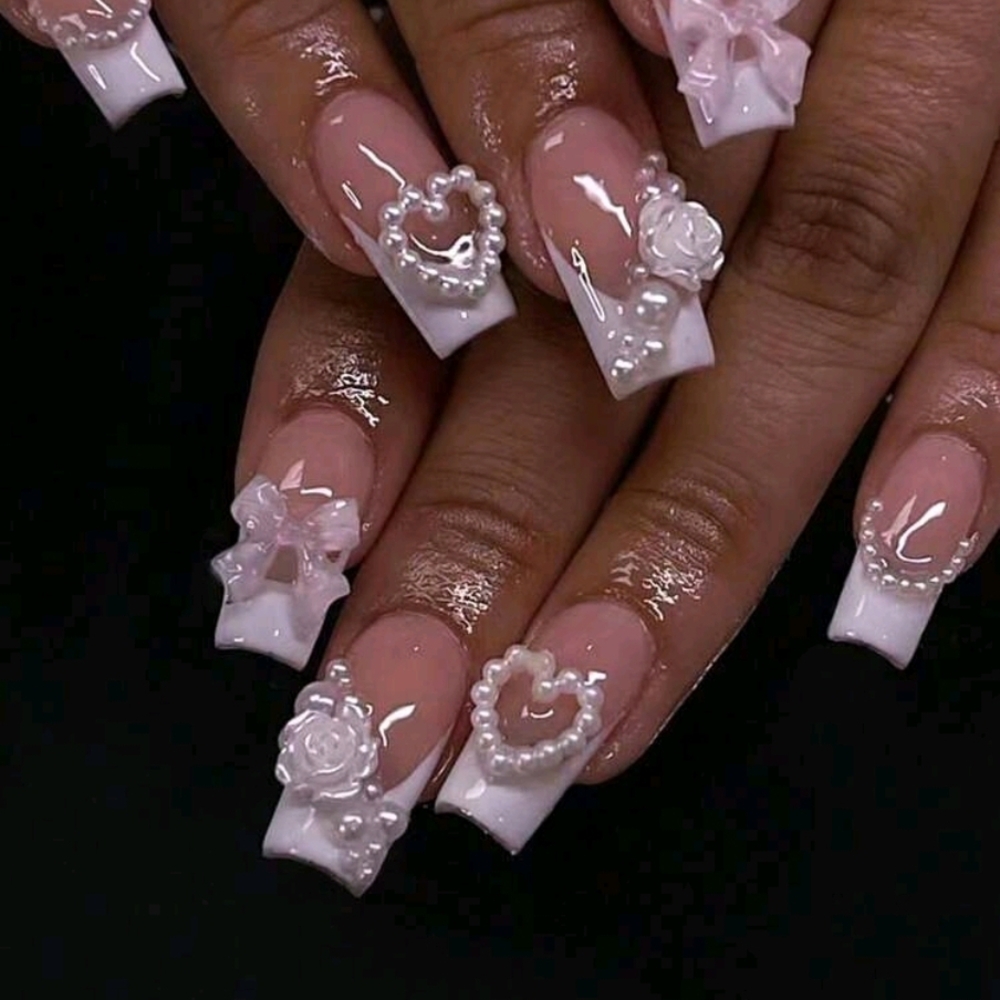 Elegant White Nail Art with Pearl Accents